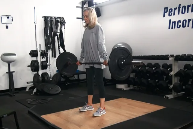 Client barbell training at Performance Incorporated